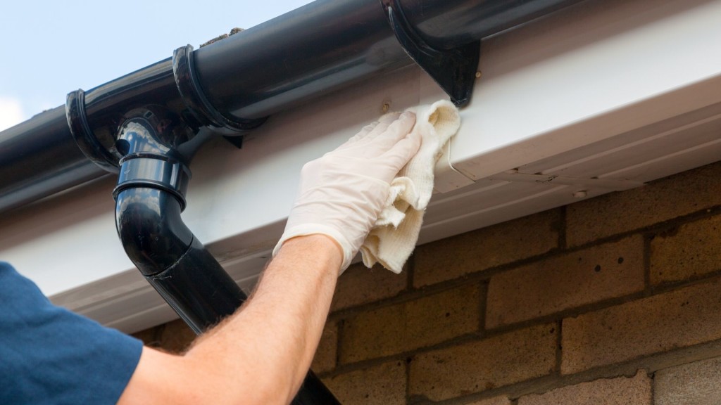 man fixing upvc guttering